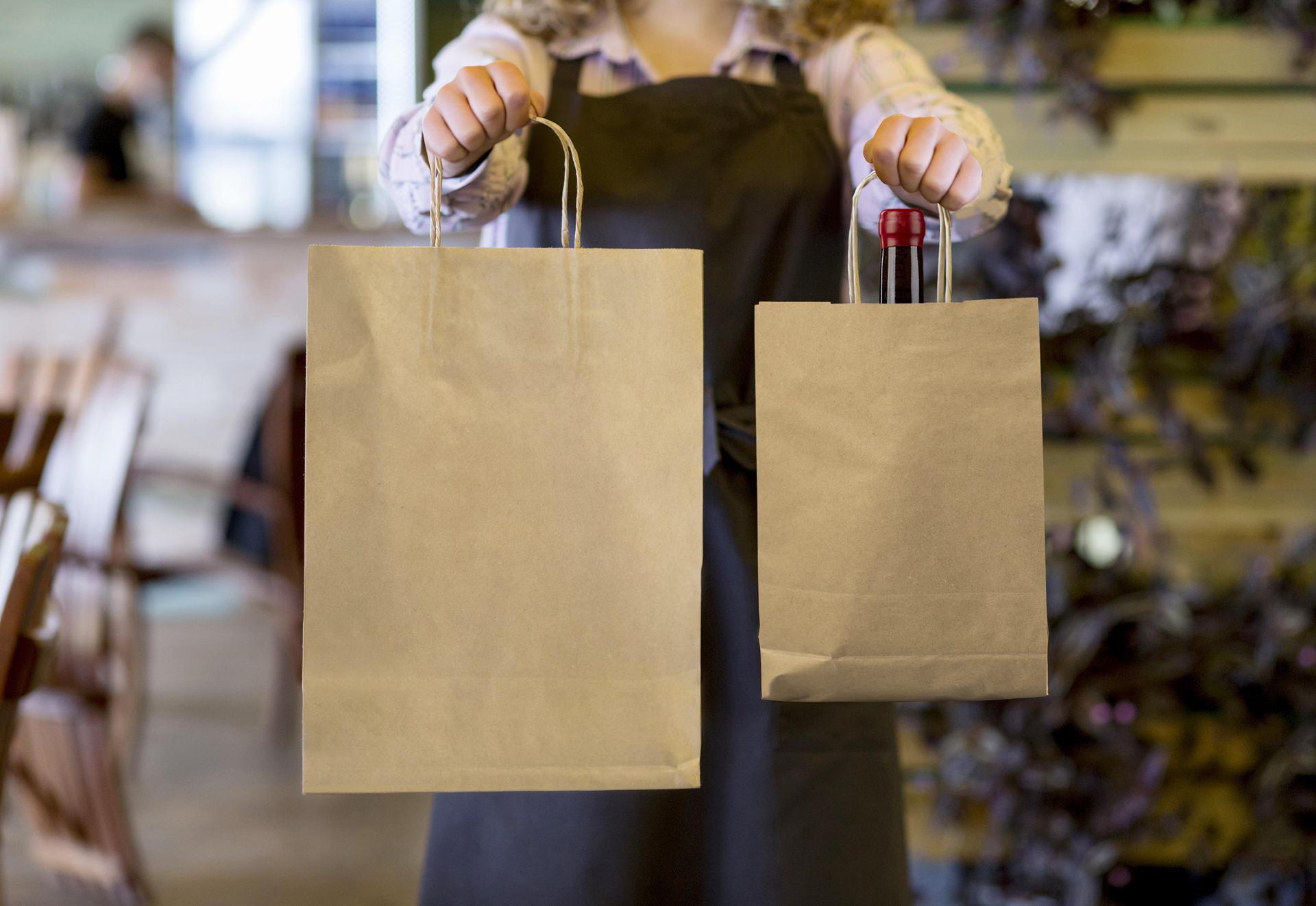 Food Delivery Worker Carrying Two Paper Bags Food Delivery Worker Carrying Two Paper Bags